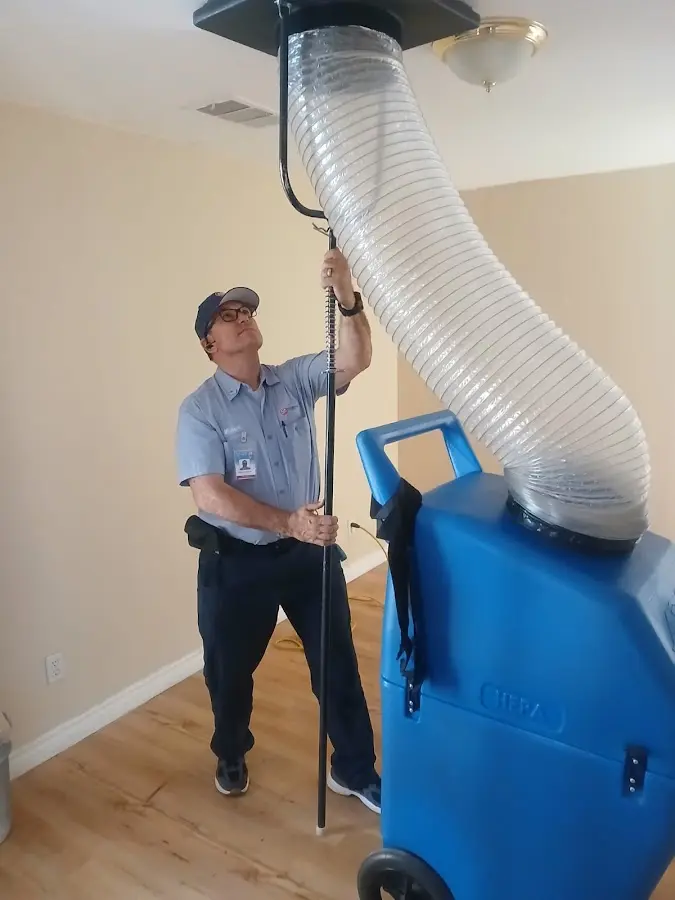 Furnace Tune-Up technician using HEPA equipment in Smyrna